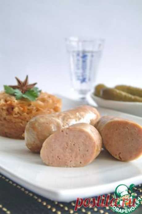 Домашние свиные колбаски с тушеной капустой - кулинарный рецепт