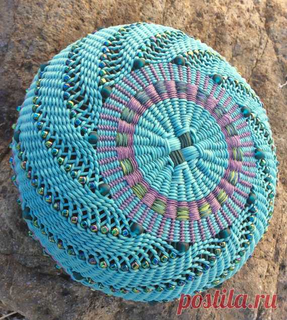 Precious by Twisted Spokes : Hand Woven Basket, Twined Basket, Waxed Linen, Cotton Cord, Handwoven Precious (2015)  This basket was made with 1mm light teal green waxed cotton cord. The bottom and the top of the basket has a stacking design woven with variegated silk ribbon and 1/2mm lavender cotton cord. Its appealing shape comes from the beads that swirl around the basket. The two toned scalloped braided rim intertwined with beads was created using 1mm light teal green a...