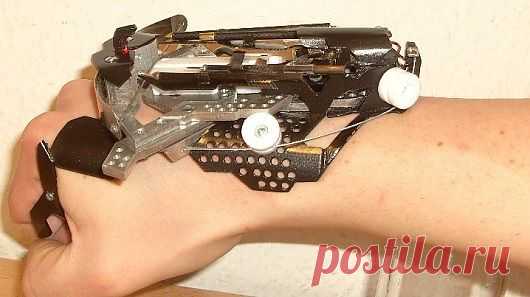wrist-mounted laser-sighted mini crossbow. | Weapons & 2nd Amendment …