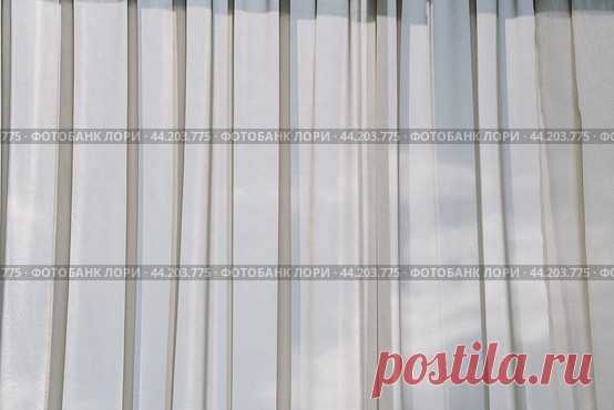 Window with light tulle curtains. Стоковое фото, фотограф Ilaronsia / Фотобанк Лори