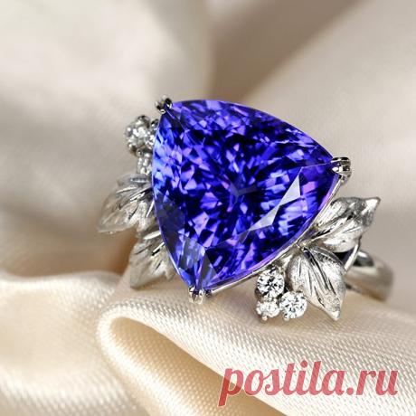 tanzanite ring. Vivid dark Tanzanite beats Amethyst every single day of the week. Unless you can find top notch brazilian amethyst