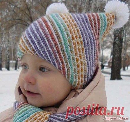 Шапка детская и шарфик по диагонали спицами
Слова автора:
• Размер 2 года
• Обхват головы 46см
• Материалы Пряжа Opal Solids (425 м100 г), цвет белый №2620, расход пряжи 100г и пряжа Opal Regenvald 6-Ply (420 м150 г), цвет №2750, расход пряжи 60г. Cпицы 2,5мм.
• Плотность вязания 26 петель х 15 рядов платочной гладью на спицах 2,5мм = 10см х 10см
• Платочная гладь все ряды лицевыми.
• Косоедиагональное вязание в начале каждого нечетного ряда делаем накид после первой петли (я первую петлю провяз