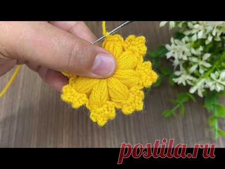 Watch how to make a simple pouf flower