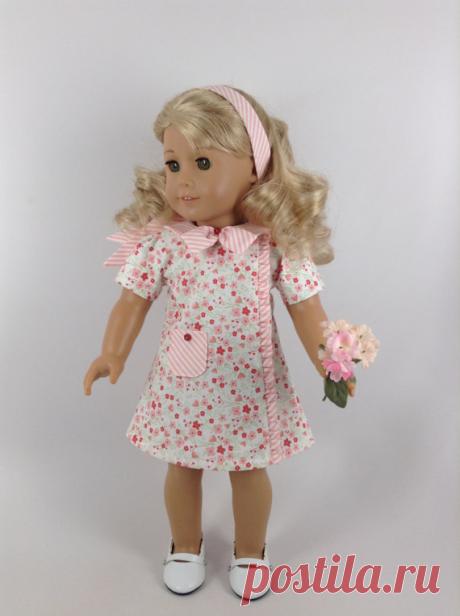 1960's Dress & Headband for 18-inch American Girl Doll Handmade dress and headband for American Girl and other similar 18-inch dolls.  My dolly is modeling an A-lined 1960s-style cotton dress with pink and rusty pink flowers and green leaves and stems on white. Dress features include a round collar, standard sleeves, a ruffle insert down the dress front, an attached bow with button accent at the neck, a functioning pocket with button accent, and four pink buttons on the dr...