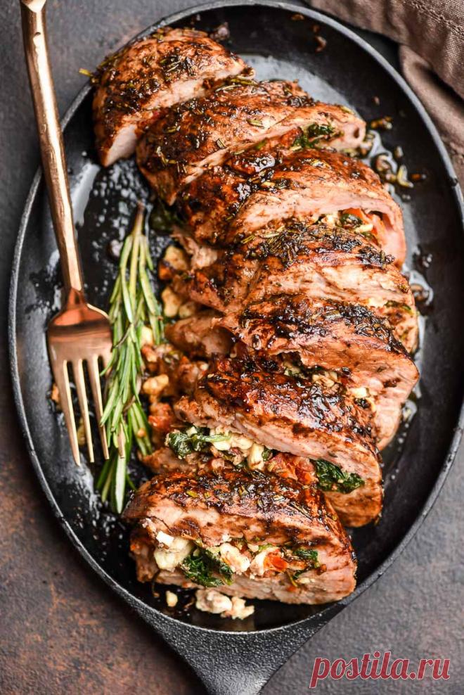 Mediterranean Stuffed Pork Tenderloin (Recipe + Tips) | NeighborFood Feta, spinach, and sundried tomatoes give my Stuffed Pork Tenderloin its signature Mediterranean flair. Topped with tangy balsamic and rosemary glaze.