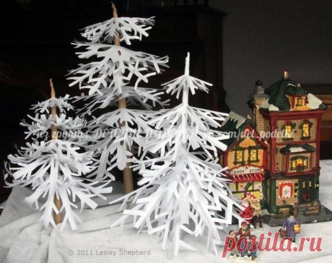 Зимние деревья из снежинок Зимние деревья из снежинокПросто нанижите снежинки на стержень.