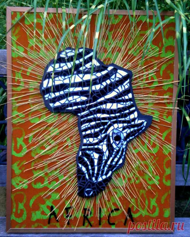 Mixed Media Zebra Challenge Entry Zebra Head is in the shape of the  Continent of Africa.  Fabric background is a batik from Africa which I purchased from Etsy and the letters were also purchased from etsy  The straw-like sunburst pattern behind the head was chosen to interpret  the dry african plains.