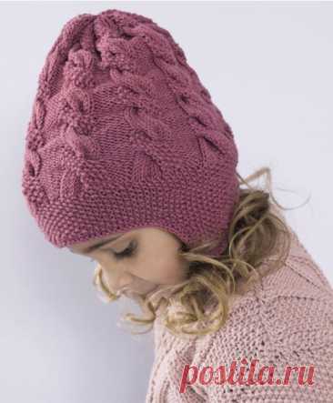 Шапочка с ушками, вяжем для детей Для возраста 1-2 года (4-8) лет.Пряжа LERKE 53 % мериносовая шерсть, 47 % египетский хлопок, 50 гр. = ок. 115 метров - 2 (3) мотка, цв. Mork gammelrosa 8113.Спицы 4 мм круговые и чулочные.Плотность вязания:22п лиц.гладью = 10 см20п жемчужным узором = 10 см.1 раппорт узора С из 17 петель =...