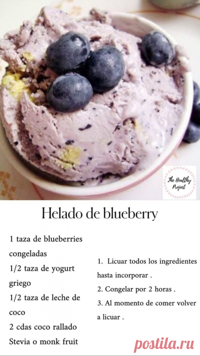 a bowl filled with ice cream and blueberries on top of a white tablecloth
