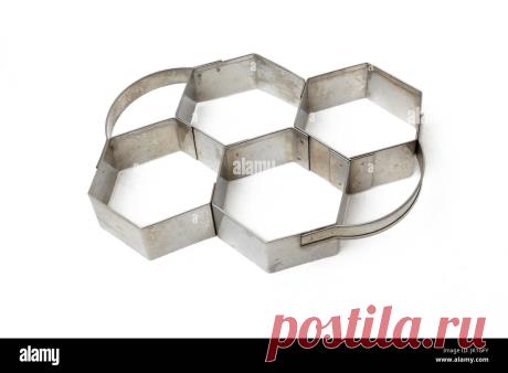 Hexagonal de acero inoxidable Cortador de pastelería Fotografía de stock - Alamy Descargar esta imagen: Hexagonal de acero inoxidable Cortador de pastelería - JK1GFY de la biblioteca de Alamy de millones de fotografías, ilustraciones y vectores de alta resolución.