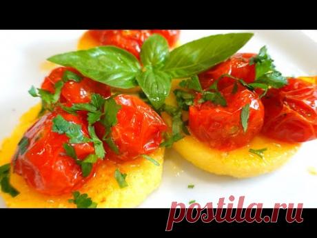 Полента с сыром, томатами, и базиликом ( Рецепт поленты ) // Polenta - YouTube Форма  22*14 см.  Получается 8 квадратов. Или 7 кругов. 

Помидоры Черри 24 шт. ( если сервировать по 3 шт. как я )
Орегано ( душица )
Соль 
Чеснок 2 зубчика. 
Оливковое масло 1 чл. 
Кукурузная мука 100 гр. 
Бульон 300 мл.  ( Я взяла куриный, можно овощной )
Сыр тертый 50 гр. 
Сливочное масло 1 чл с верхом. 
Соль
Зелень. У меня петрушка и базилик.