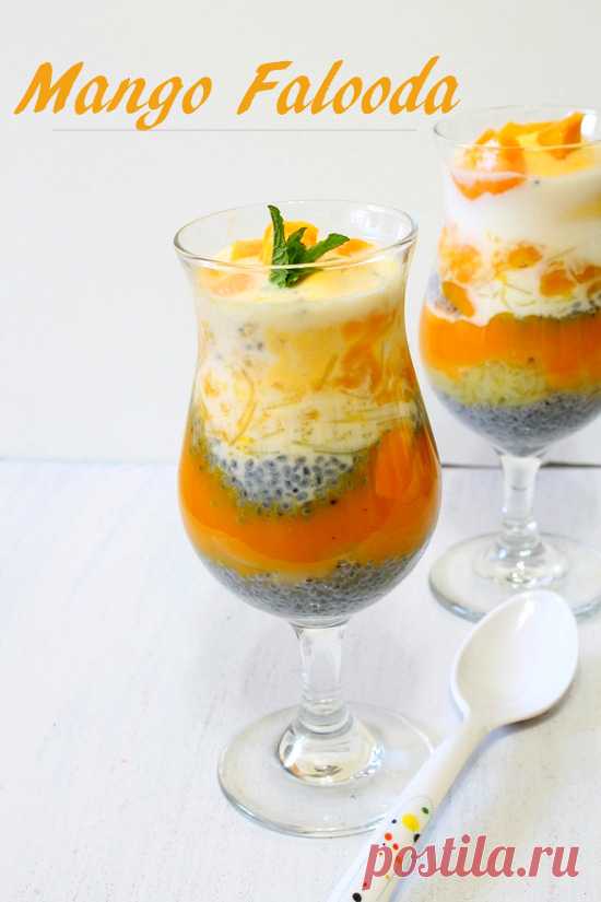 Mango falooda - layered summer beverage cum dessert made with milk, mango pulp, basil seeds, falooda sev and topped with ice cream.