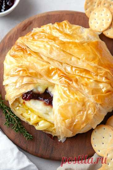 Best Baked Brie in Phyllo Dough Recipe What's better than regular brie cheese? Brie wrapped in flaky phyllo dough and baked until golden!
