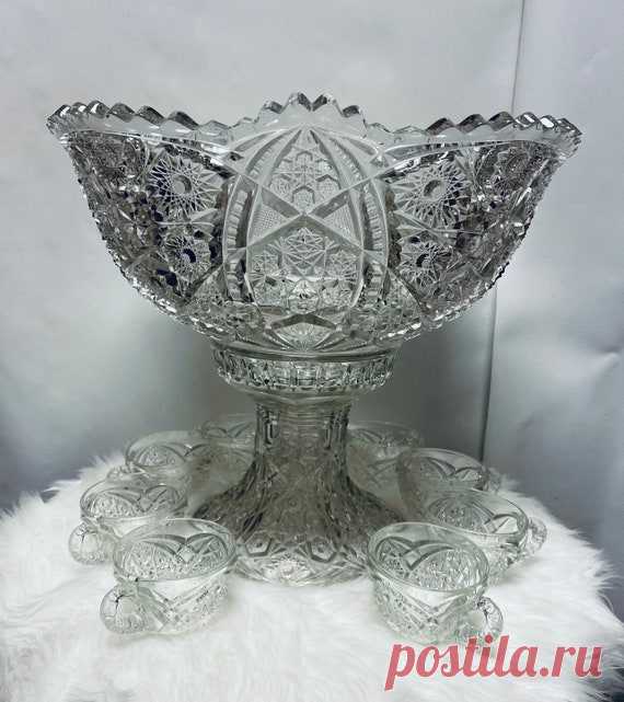 *****Vintage Centerpiece Punch Bowl Set | Etsy Vintage Centerpiece Punch Bowl Set  Thick Ornate Large Sawtooth Edge Glass bowl  with stand and cups Includes: 1 bowl, 1 stand & 8 pcs cups Measurements: 14’ H bowl w/stand  3/8’ thick glass  7’ H & 16’ L -bowl only  7’ H- stand only  2 1/2’ H & 3 1/4’ L- cup Condition: Great condition except 1 cup