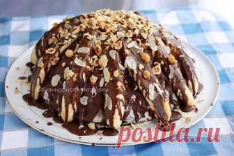 Всеми любимый ТОРТ 'ПАНЧО' - СУПЕР БАНАНОВЫЙ! Легко и безумно вкусно!

Понадобится:
Коржи:
(светлый)
1 ст. кефира
1яйцо
1 ст. сахара
1 ст. муки
1 ч.л. соды
(темный)
1 ст. кефира
1яйцо
1 ст. сахара
1 ст. муки
1 ч.л. соды
2 ст.л. какао
Начинка:
6 баночек бананового йогурта (100 граммовых)
бананы 4-5 шт
Украшение:
4-5 бананов
2 баночки бананового йогурта
шоколад 100 г + 2 ст.л. раст. масла
орехи любые для посыпки
Форма 24 см

Приготовление:

Разогрейте духовку до 180 С
В миск...