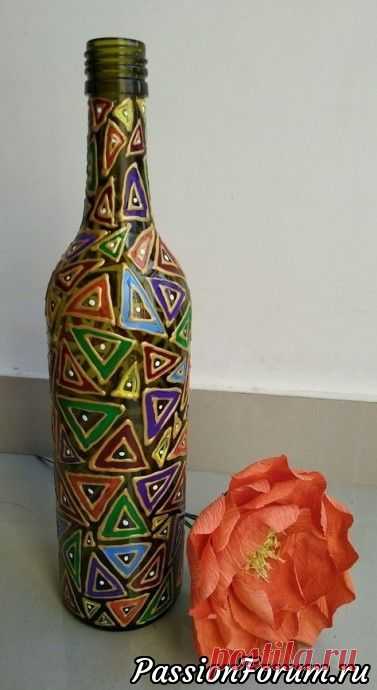 This lovely, boho lantern faux stained glass project was made by covering an old glass bottle with hand formed polymer clay tiles and faux soldering. The clay was textured, baked and then painted…