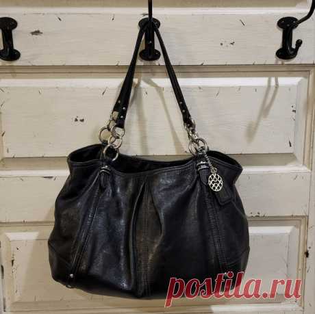 Authentic Coach Alexandra Black Leather Shoulder Bag Purse H1073-16244 Shop kkbarkley's closet or find the perfect look from millions of stylists. Fast shipping and buyer protection. Authentic Coach Alexandra Black Leather Shoulder Bag Purse H1073-16244

14" by 12" by 7" with 10.5" drop strap. Coach Alexandra versatile tote bag in Excellent pre-owned condition. 

2 patch pockets on interior
1 Large zippered pocket in interior middle
2 Large Main compartments
Lined in light...