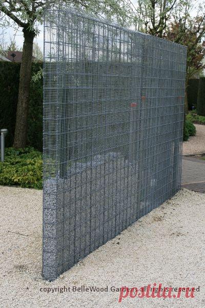 (1) Some innovative ideas on display at Appeltern Gardens, such as this hardware cloth metal mesh gabion-like fence, or perhaps it's a wall, partially …
