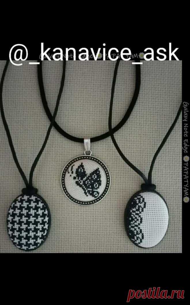 three necklaces with black and white designs on them