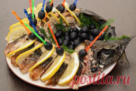 Осетр по-царски, запеченный, фаршированный форелью рецепт с фото