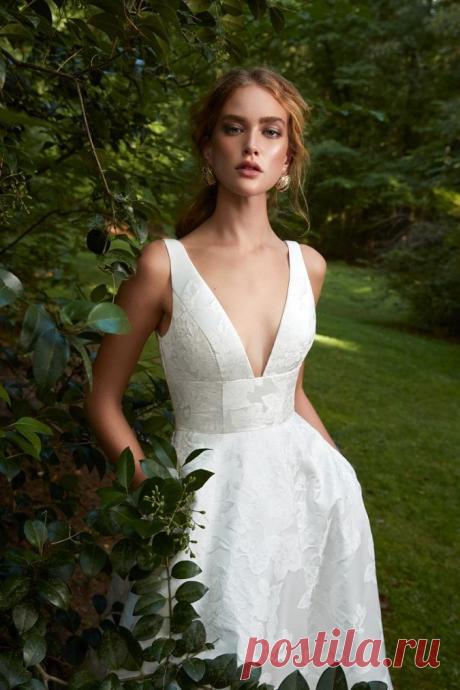 Wedding dress with pockets and and plunging square v neckine