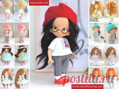 Tilda Doll Handmade Art Doll in Glasses Fabric Rag Doll | Etsy Hello, dear visitors!  This is handmade textile tilda doll created by Master Maria L (Kazan, Russia). Doll can be made by Order. Doll is 21-22 cm (8.6 inch) tall. This fabric cloth doll can move hands, turn head, sit and stand. Dolls hair are natural and made from sheep. Cloth and shoes are