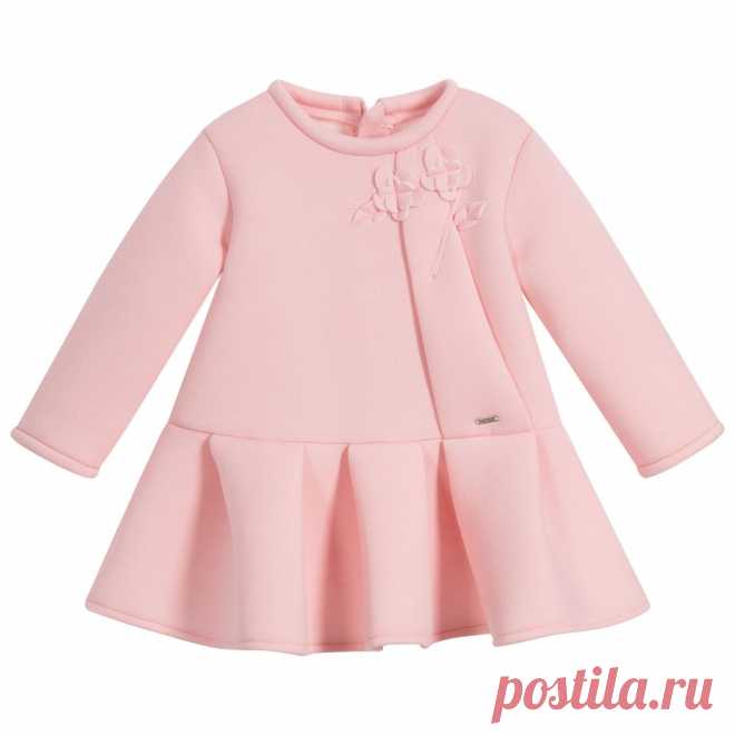 Girls Pink Neoprene Dress In a lovely shade of pale pink, a soft neoprene dress for little girls by Mayoral. This long-sleeved, viscose blend dress has pretty floral appliqué on the front, a branded metal plaque and a gently pleated skirt. 
