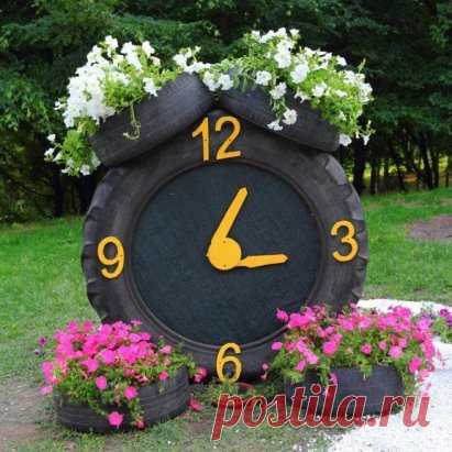 Клумба-часики из старых покрышек.