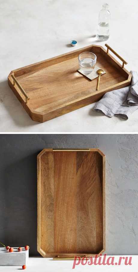 The sides of this wood tray eliminate the worry of things being knocked off, and the bar handles on both sides of the tray make it easy to transport and move when necessary.