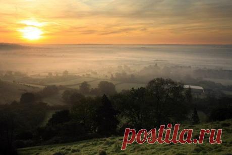 The sun begins to rise over the Somerset Levels looking towards Pilton on October 13, 2009 near Glastonbury, England. Source: Matt Cardy/Getty Images Europe | Autumn Colours Throughout The UK - Pictures - Zimbio