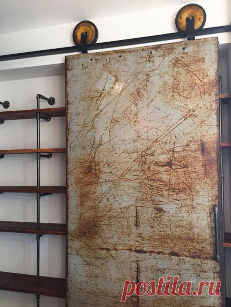 Metal Sliding Barn Door with Vintage Lawnmower Wheels
