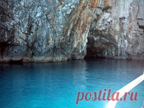 (2) This is Montenegro
Plava Spilja (Blue Grotto) – Blue Cave

Imagine if you found a small boat on the side of a tranquil bay and the captain, after helping you on board, set sail up the coast for what only seemed like a 10 minute trip. You’re headed towards Plava Spilja, and the excitement takes hold of you. You’re expectations are running high, although after your short trip the captain suddenly steers the boat directly at a cliff of rough rocks.
