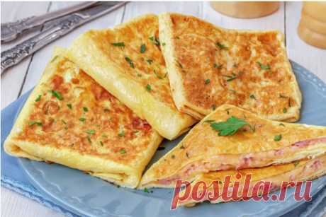 Яичные конвертики с сыром и ветчиной

Сытное и вкусное блюдо «с изюминкой», которое можно приготовить всего из 3 ингредиентов, — аппетитные, нежные и румяные яичные конвертики с ветчиной и сыром. Отличная альтернатива привычной яичнице для завтрака или перекус на скорую руку.