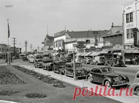 Graham Hollywood: 1942 April 1942. "Portuguese-American communities in California. Main street (East 14th at Callan) in San Leandro." Our title is in honor of that low-slung, supercharged  Graham Hollywood -- one of the decade's quirkier cars -- parked at the curb. Acetate negative by Russell Lee for the Foreign Information Service of the U.S. Office of Coordinator of Information.