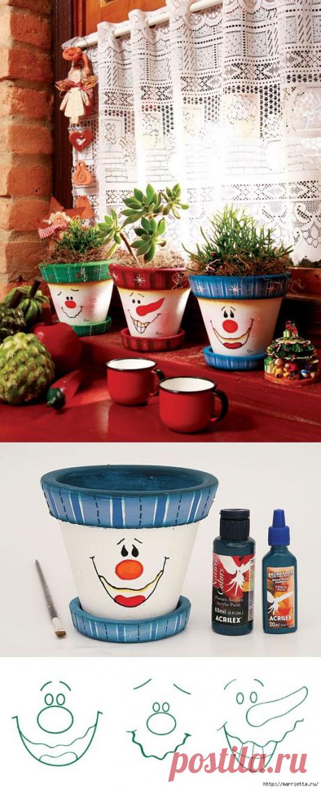 Роспись рожицами цветочных горшков