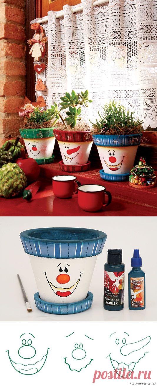 Роспись рожицами цветочных горшков