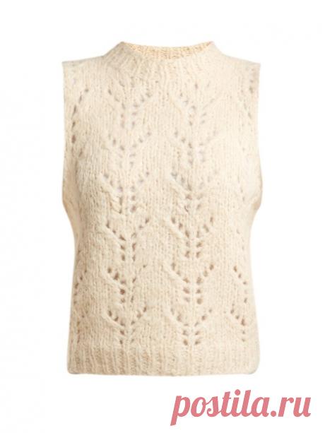 Женственный топ от бренда Sea. 
#вязание #вязание_спицами #схема_узора #ажурный_узор 
Топ выполнен из смеси альпаки и шерсти и дополнен вышитыми рукавами из органзы. Образ можно дополнить юбкой миди и ковбойскими сапогами.
Узор очень напоминает узор популярного пуловера от Ganni. На схеме показаны лицевые ряды. Изнаночные ряды вязать изнаночными. 
Обозначения к схеме в фотоальбоме https://vk.com/album-83459950_211907967