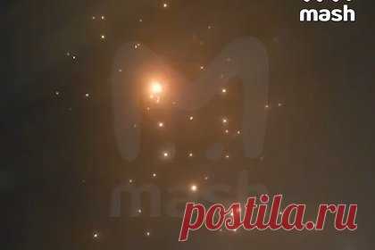 Дождь из обломков сбитого беспилотника в столице региона России сняли на видео