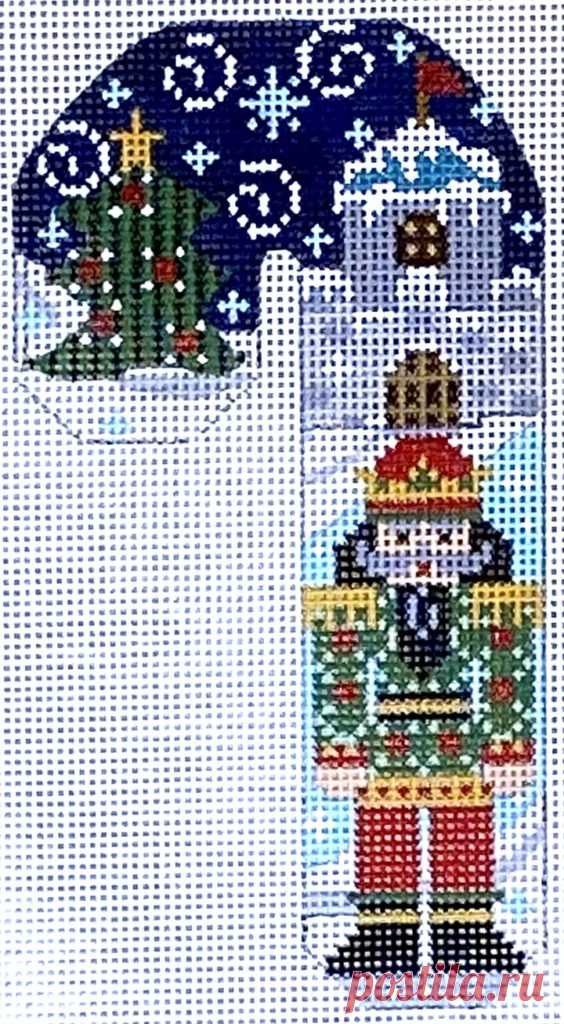 Green and Red Nutcracker Candy Cane This candy cane features a green and red nutcracker in front of a castle and Christmas tree. 5.25 x 3