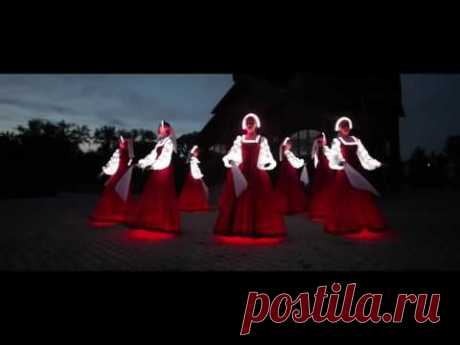 Russian folk dance in Siberia. Artists of LED show "CARE"