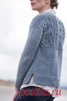 This pullover in Shelter honors every feature of the traditional gansey. Stout chain cables boldly mark the textured yoke both fore and aft. The gentlest of A-lines makes for an easy fit, and details like the split ribbed hem and decorative side seams make Caspian both eye catching and knitterly. The front and back are