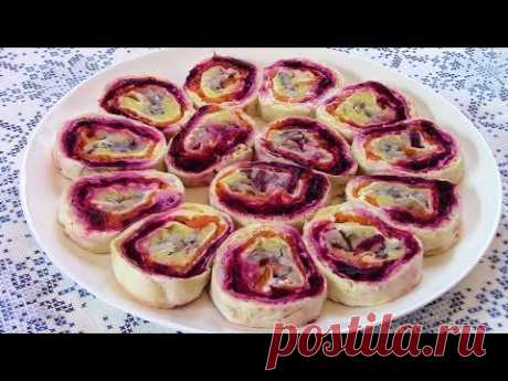 Рулет из лаваша с сельдью под шубой - отличная закуска на праздничный стол .