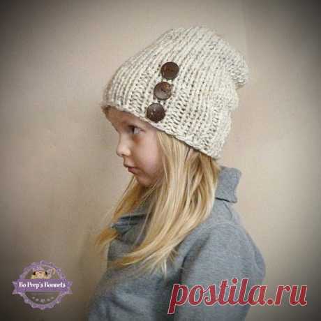 Toddler Slouch Hat in Wheat with Three Natural Coconut Buttons, Girls Slouchy Beanie, Slouch Beanie Boys Kids Children Toddler Knit Hat This hand knit slouchy beanie for kids is made of soft wheat yarn. The hat is knit with a great hipster slouch and has three natural coconut buttons hand sewn onto the hat. Please select a size from the drop down menu on the right when ordering:  Young Toddler: Head Circumference 18