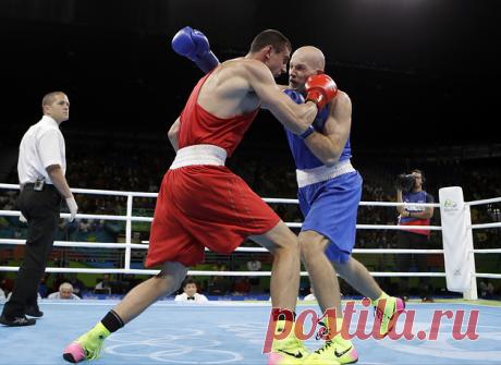 © AP Photo/Frank Franklin II. РИО-ДЕ-ЖАНЕЙРО, 16 августа. /ТАСС/. Российский боксер Евгений Тищенко стал чемпионом Олимпийских игр 2016 года в весовой категории до 91 кг. В финале 25-летний россиянин победил казахстанца Василия Левита со счетом 3:0. Подробнее на ТАСС: https://tass.ru/sport/3541111  | ТАСС: Спорт - Боксер Евгений Тищенко завоевал золото Олимпийских игр