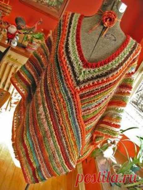 Crochet poncho - a long wrap stitched together with a…