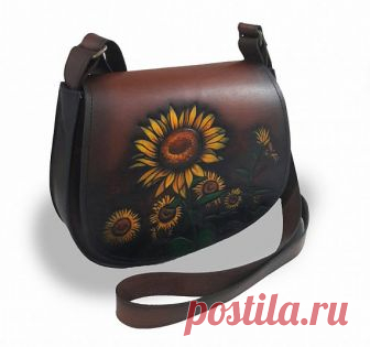 Elegant leather bag, author's handmade. With a picture of sunflowers. Leather handbag, authors manual work. With a replaceable valve. With a picture of a cat.Leather handbag, authors manual work. With a replaceable valve. With the drawing of the cat. The handbag of handmade work. The drawing was made by an airbrush. Excellent quality.Size 27/21 centimeters