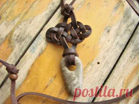 Rock of Gibraltar Celtic Knot necklace This is a necklace made from an actual piece of the Rock of Gibraltar. Gibraltar is made up of Jurassic limestone from 350 million years ago. Limestone is made up of a composite of matter compressed together from the great sea of history. This piece is a prime example, it looks like a piece