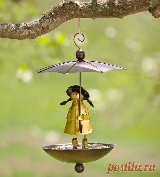 Handcrafted Metal Brolly Rain Girl Birdfeeder | Wind and Weather Forecast calling for rain No worries for hungry birds: this little weather girl holds her wide-top umbrella high over a deep basin to keep seed nice and dry. Under her charming slicker and boots are holes that drain unwanted moisture from the dish. Hangs from porch, tree limb or pole and becomes unsteady under the weight of squirrel's to deter them from eating from the feeder. Made of metal with a bright, ...