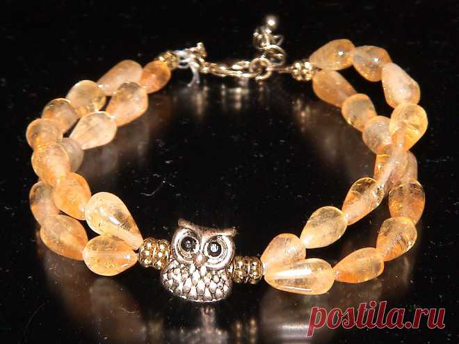 Браслет из янтаря с совой.