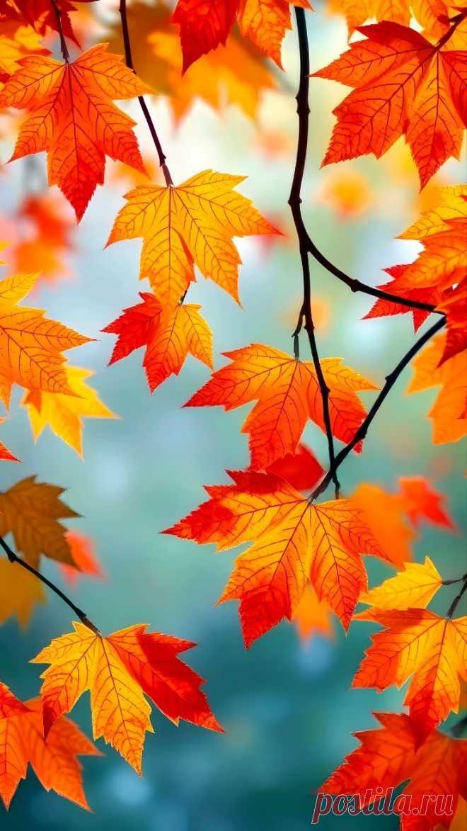 colorful leaves are hanging from a tree branch